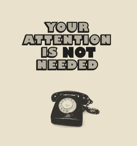 Your Attention Is Not Needed, over a black rotary telephone